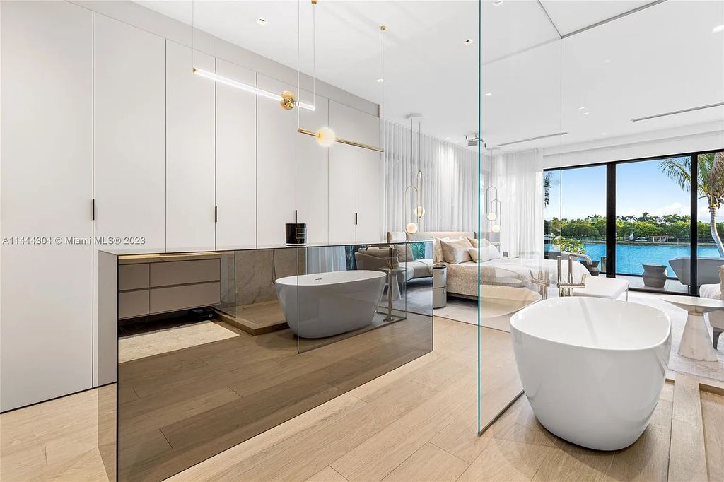 This 4 bedroom, 4 bathroom single-family home is located in the heart of Miami Beach and features an impeccable modern open-concept layout, high-end fixtures and finishes, and an incredible backyard with water features, lush landscaping, and 60 feet of waterfrontage.