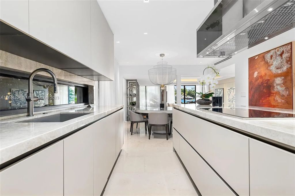 This 4 bedroom, 4 bathroom single-family home is located in the heart of Miami Beach and features an impeccable modern open-concept layout, high-end fixtures and finishes, and an incredible backyard with water features, lush landscaping, and 60 feet of waterfrontage.