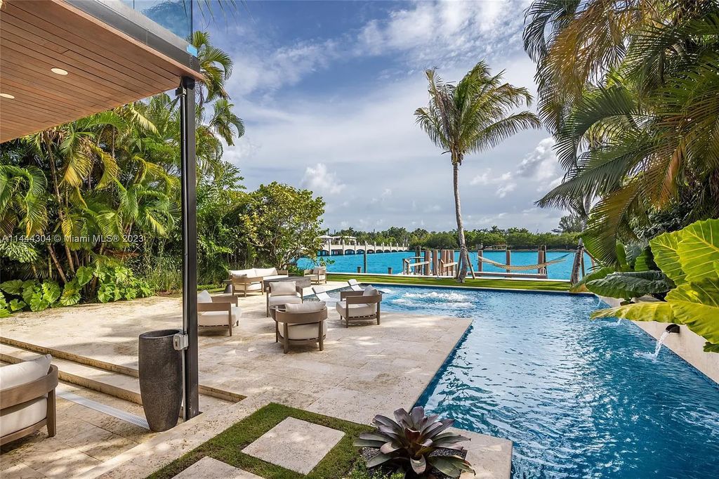 This 4 bedroom, 4 bathroom single-family home is located in the heart of Miami Beach and features an impeccable modern open-concept layout, high-end fixtures and finishes, and an incredible backyard with water features, lush landscaping, and 60 feet of waterfrontage.