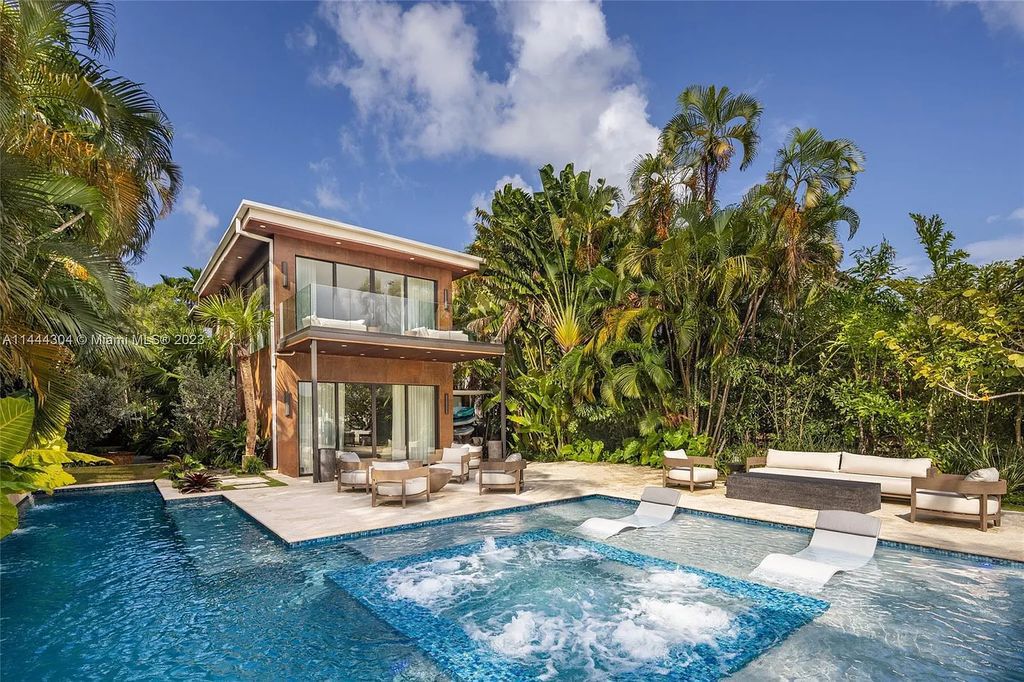 This 4 bedroom, 4 bathroom single-family home is located in the heart of Miami Beach and features an impeccable modern open-concept layout, high-end fixtures and finishes, and an incredible backyard with water features, lush landscaping, and 60 feet of waterfrontage.