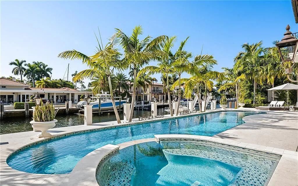 This stunning 5 bedroom / 7.5 bath luxury villa in Fort Lauderdale, FL offers the ultimate in waterfront living. With breathtaking views of the canal, a private dock, and a resort-style pool, this home is perfect for entertaining guests or simply relaxing and enjoying the Florida lifestyle.