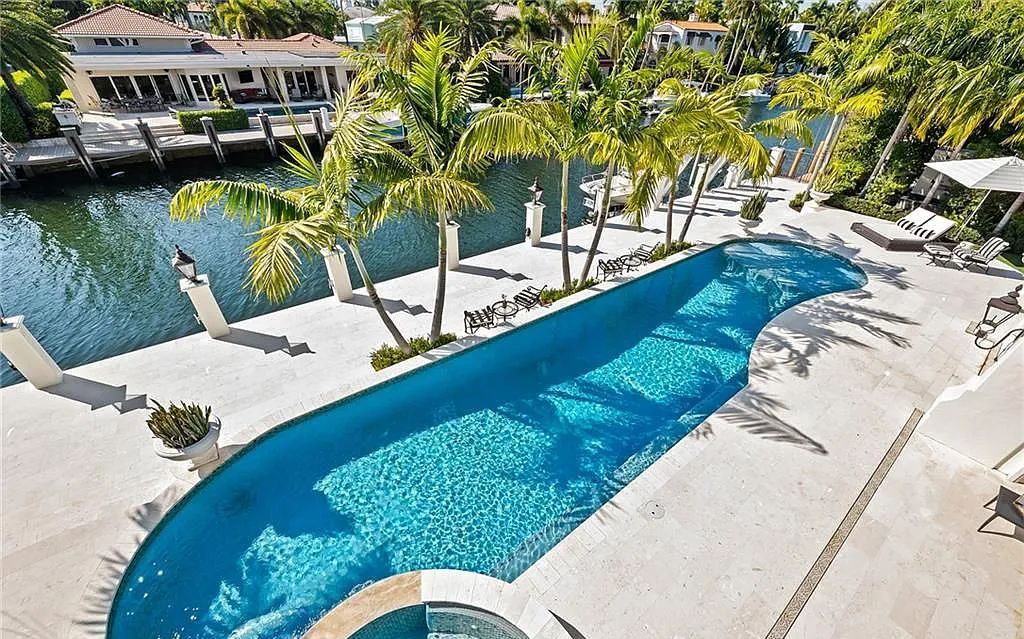 This stunning 5 bedroom / 7.5 bath luxury villa in Fort Lauderdale, FL offers the ultimate in waterfront living. With breathtaking views of the canal, a private dock, and a resort-style pool, this home is perfect for entertaining guests or simply relaxing and enjoying the Florida lifestyle.