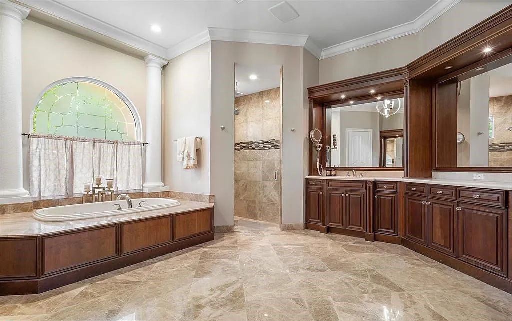 Gold Standard in Luxury & Privacy! Exceptional finishes, the finest craftsmanship, meticulous millwork & soaring vaulted groin coffered ceilings perfectly blend to create a sophisticated & special estate. Walls of impact glass welcome in soft natural light, views of the glorious pool & beautiful outdoor spaces throughout.