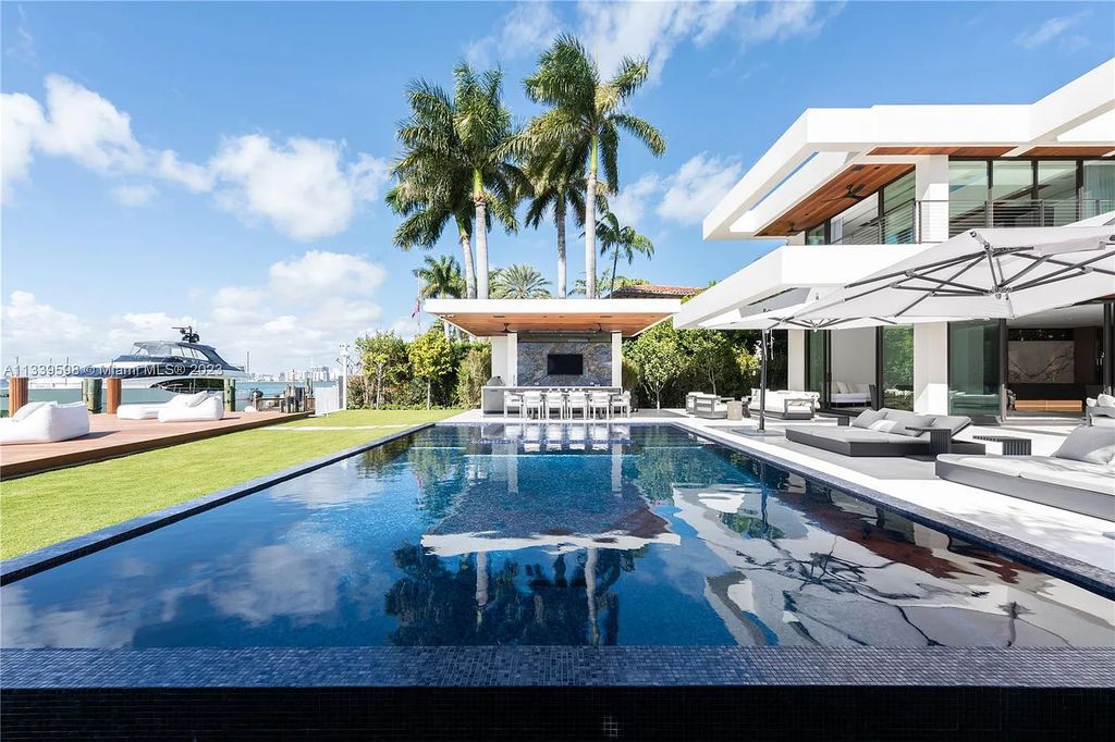 This luxurious waterfront residence in Miami Beach is the ultimate in luxury living. With 7 bedrooms, 7 bathrooms, and 2 half baths, this home has plenty of space for everyone. Enjoy stunning views of the city from the rooftop terrace, or relax in the heated saltwater pool and spa. This private gated property also has a boat dock and 70 feet of waterfront.