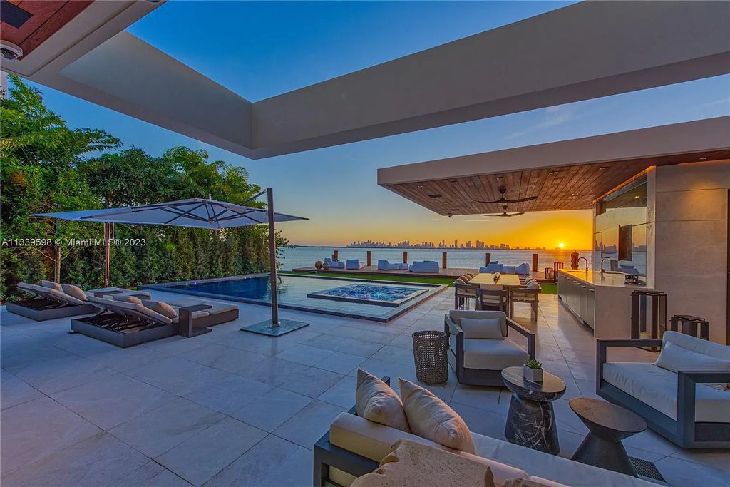 This luxurious waterfront residence in Miami Beach is the ultimate in luxury living. With 7 bedrooms, 7 bathrooms, and 2 half baths, this home has plenty of space for everyone. Enjoy stunning views of the city from the rooftop terrace, or relax in the heated saltwater pool and spa. This private gated property also has a boat dock and 70 feet of waterfront.