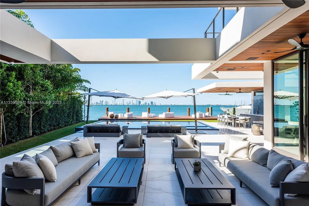 This luxurious waterfront residence in Miami Beach is the ultimate in luxury living. With 7 bedrooms, 7 bathrooms, and 2 half baths, this home has plenty of space for everyone. Enjoy stunning views of the city from the rooftop terrace, or relax in the heated saltwater pool and spa. This private gated property also has a boat dock and 70 feet of waterfront.