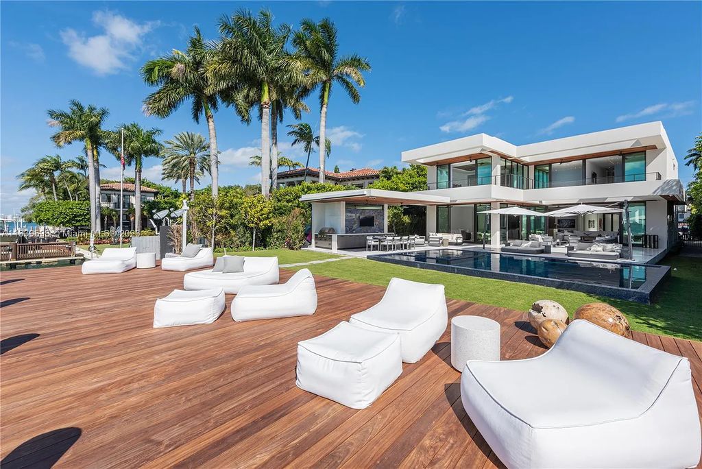 This luxurious waterfront residence in Miami Beach is the ultimate in luxury living. With 7 bedrooms, 7 bathrooms, and 2 half baths, this home has plenty of space for everyone. Enjoy stunning views of the city from the rooftop terrace, or relax in the heated saltwater pool and spa. This private gated property also has a boat dock and 70 feet of waterfront.