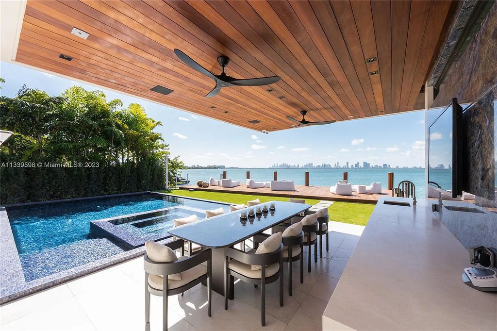 This luxurious waterfront residence in Miami Beach is the ultimate in luxury living. With 7 bedrooms, 7 bathrooms, and 2 half baths, this home has plenty of space for everyone. Enjoy stunning views of the city from the rooftop terrace, or relax in the heated saltwater pool and spa. This private gated property also has a boat dock and 70 feet of waterfront.