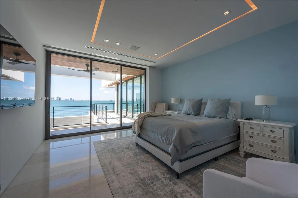 This luxurious waterfront residence in Miami Beach is the ultimate in luxury living. With 7 bedrooms, 7 bathrooms, and 2 half baths, this home has plenty of space for everyone. Enjoy stunning views of the city from the rooftop terrace, or relax in the heated saltwater pool and spa. This private gated property also has a boat dock and 70 feet of waterfront.