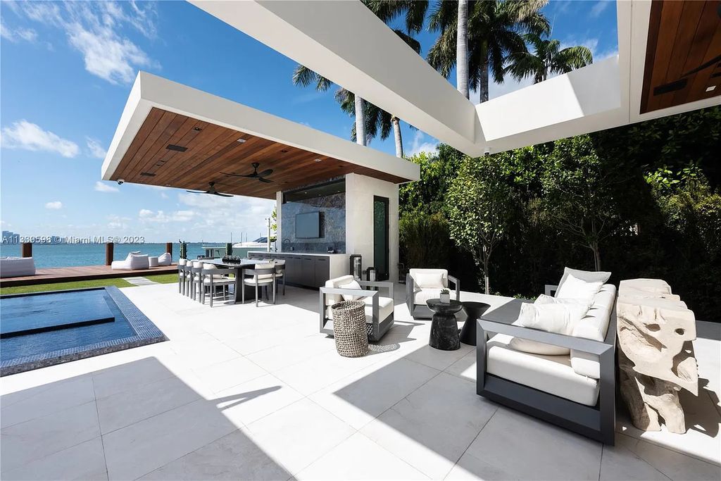 This luxurious waterfront residence in Miami Beach is the ultimate in luxury living. With 7 bedrooms, 7 bathrooms, and 2 half baths, this home has plenty of space for everyone. Enjoy stunning views of the city from the rooftop terrace, or relax in the heated saltwater pool and spa. This private gated property also has a boat dock and 70 feet of waterfront.