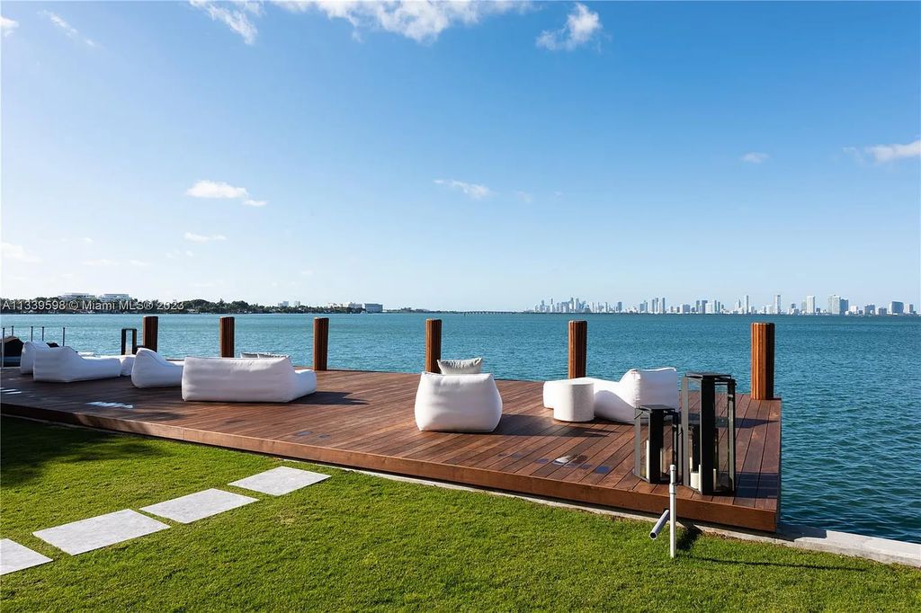 This luxurious waterfront residence in Miami Beach is the ultimate in luxury living. With 7 bedrooms, 7 bathrooms, and 2 half baths, this home has plenty of space for everyone. Enjoy stunning views of the city from the rooftop terrace, or relax in the heated saltwater pool and spa. This private gated property also has a boat dock and 70 feet of waterfront.