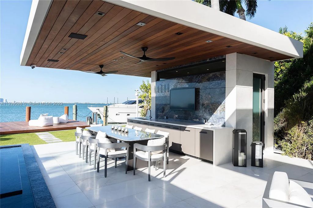 This luxurious waterfront residence in Miami Beach is the ultimate in luxury living. With 7 bedrooms, 7 bathrooms, and 2 half baths, this home has plenty of space for everyone. Enjoy stunning views of the city from the rooftop terrace, or relax in the heated saltwater pool and spa. This private gated property also has a boat dock and 70 feet of waterfront.