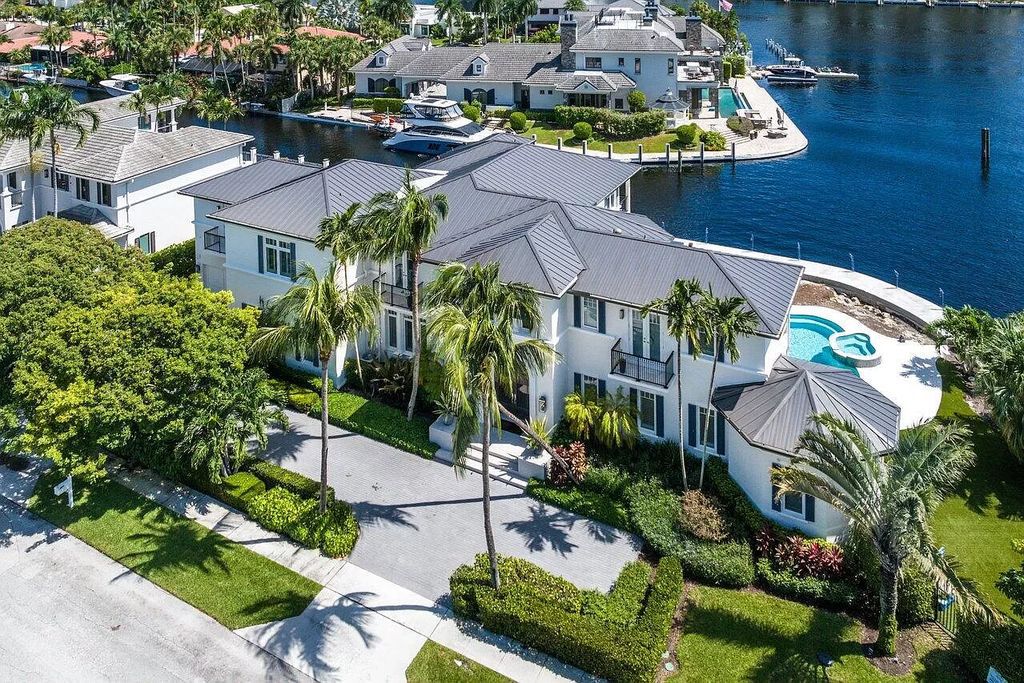 This spectacular waterfront masterpiece in Boca Bay Colony features 6 bedrooms, 8 baths, 7,282 sq ft, 265 ft of water frontage, and a deepwater dock that can accommodate a mega yacht. The chef-designed kitchen, home theater, 400-bottle wine cellar, and expansive backyard with pool, summer kitchen, and pergola offer endless possibilities for relaxation and entertainment. Schedule your private showing today!