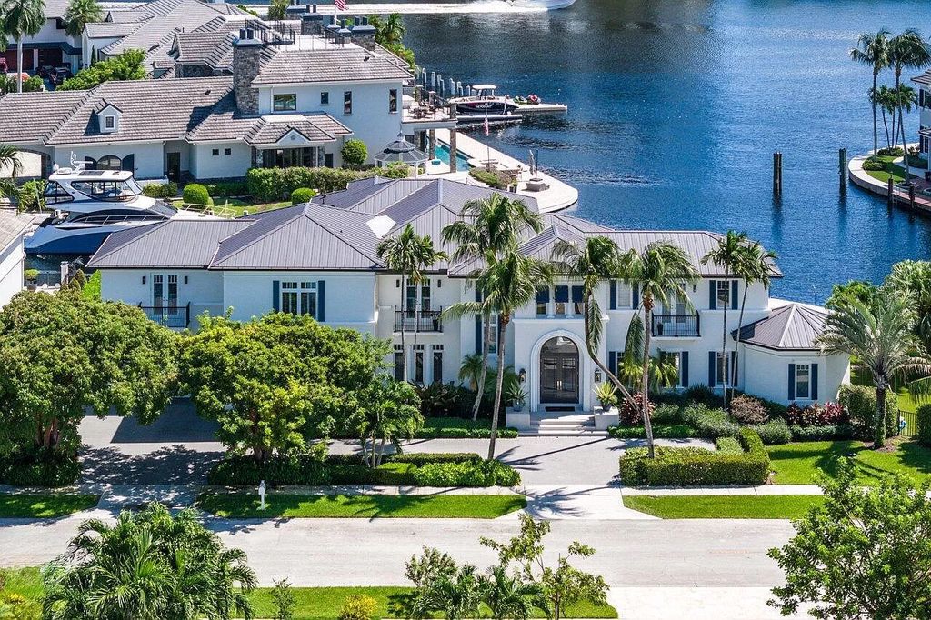 This spectacular waterfront masterpiece in Boca Bay Colony features 6 bedrooms, 8 baths, 7,282 sq ft, 265 ft of water frontage, and a deepwater dock that can accommodate a mega yacht. The chef-designed kitchen, home theater, 400-bottle wine cellar, and expansive backyard with pool, summer kitchen, and pergola offer endless possibilities for relaxation and entertainment. Schedule your private showing today!