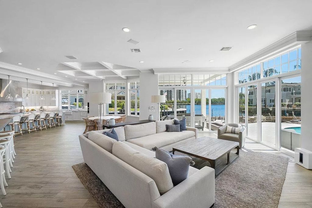 This spectacular waterfront masterpiece in Boca Bay Colony features 6 bedrooms, 8 baths, 7,282 sq ft, 265 ft of water frontage, and a deepwater dock that can accommodate a mega yacht. The chef-designed kitchen, home theater, 400-bottle wine cellar, and expansive backyard with pool, summer kitchen, and pergola offer endless possibilities for relaxation and entertainment. Schedule your private showing today!