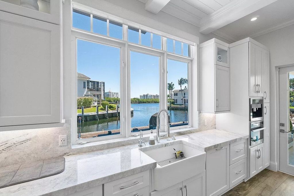 This spectacular waterfront masterpiece in Boca Bay Colony features 6 bedrooms, 8 baths, 7,282 sq ft, 265 ft of water frontage, and a deepwater dock that can accommodate a mega yacht. The chef-designed kitchen, home theater, 400-bottle wine cellar, and expansive backyard with pool, summer kitchen, and pergola offer endless possibilities for relaxation and entertainment. Schedule your private showing today!