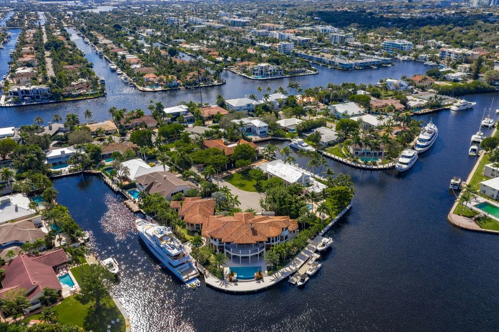 This luxurious estate in the exclusive Sunrise Key neighborhood of Fort Lauderdale offers stunning river views, a coveted point lot location, and high-end finishes throughout. The main house features marble floors, soaring ceilings, floor-to-ceiling windows, and an open floor plan perfect for entertaining.