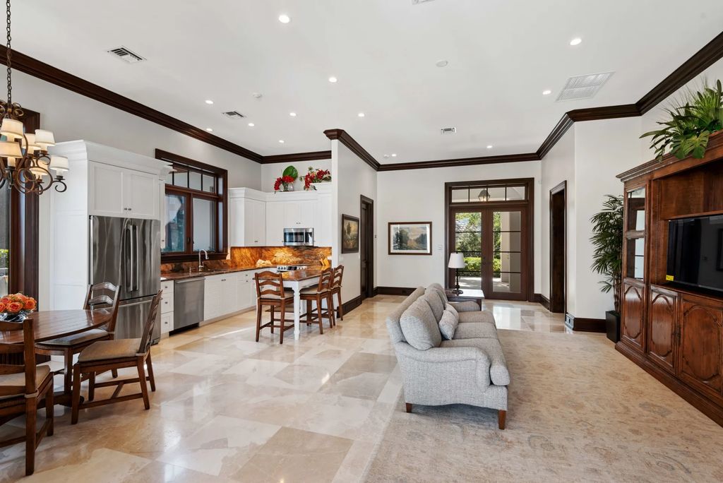 This luxurious estate in the exclusive Sunrise Key neighborhood of Fort Lauderdale offers stunning river views, a coveted point lot location, and high-end finishes throughout. The main house features marble floors, soaring ceilings, floor-to-ceiling windows, and an open floor plan perfect for entertaining.