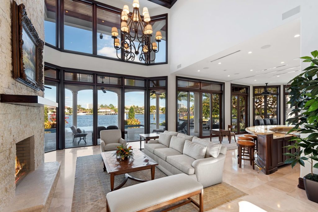 This luxurious estate in the exclusive Sunrise Key neighborhood of Fort Lauderdale offers stunning river views, a coveted point lot location, and high-end finishes throughout. The main house features marble floors, soaring ceilings, floor-to-ceiling windows, and an open floor plan perfect for entertaining.