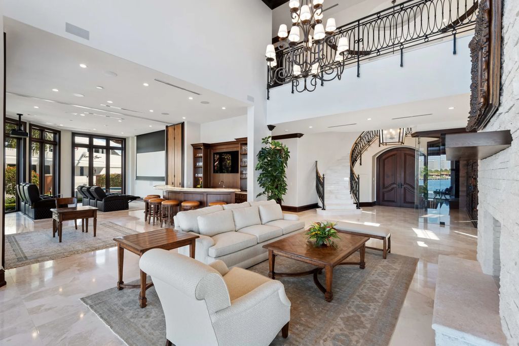 This luxurious estate in the exclusive Sunrise Key neighborhood of Fort Lauderdale offers stunning river views, a coveted point lot location, and high-end finishes throughout. The main house features marble floors, soaring ceilings, floor-to-ceiling windows, and an open floor plan perfect for entertaining.