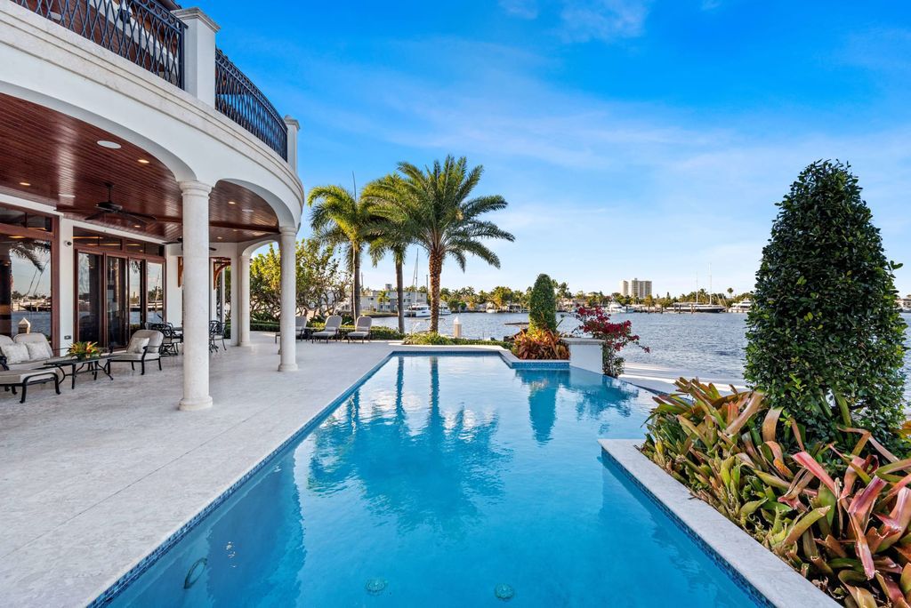 This luxurious estate in the exclusive Sunrise Key neighborhood of Fort Lauderdale offers stunning river views, a coveted point lot location, and high-end finishes throughout. The main house features marble floors, soaring ceilings, floor-to-ceiling windows, and an open floor plan perfect for entertaining.