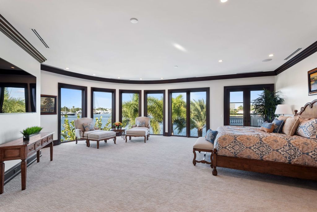 This luxurious estate in the exclusive Sunrise Key neighborhood of Fort Lauderdale offers stunning river views, a coveted point lot location, and high-end finishes throughout. The main house features marble floors, soaring ceilings, floor-to-ceiling windows, and an open floor plan perfect for entertaining.