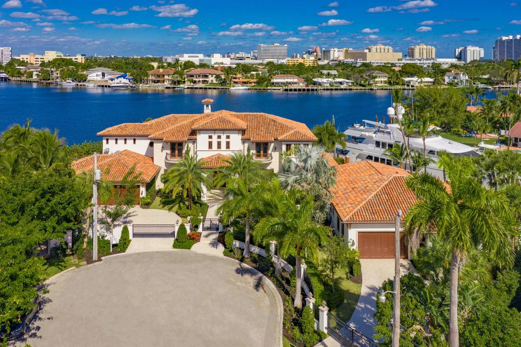 This luxurious estate in the exclusive Sunrise Key neighborhood of Fort Lauderdale offers stunning river views, a coveted point lot location, and high-end finishes throughout. The main house features marble floors, soaring ceilings, floor-to-ceiling windows, and an open floor plan perfect for entertaining.