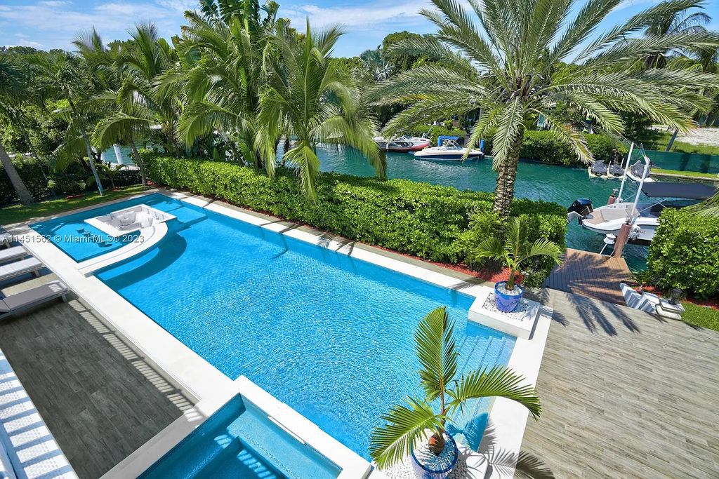 Casa Aqua is a modern-Island waterfront residence with 120 ft of water frontage, a spacious dock, and a lift to fit 2 boats. This one-story home features 7 bedrooms, 6.5 bathrooms, a gourmet kitchen, private family room, and bonus room.