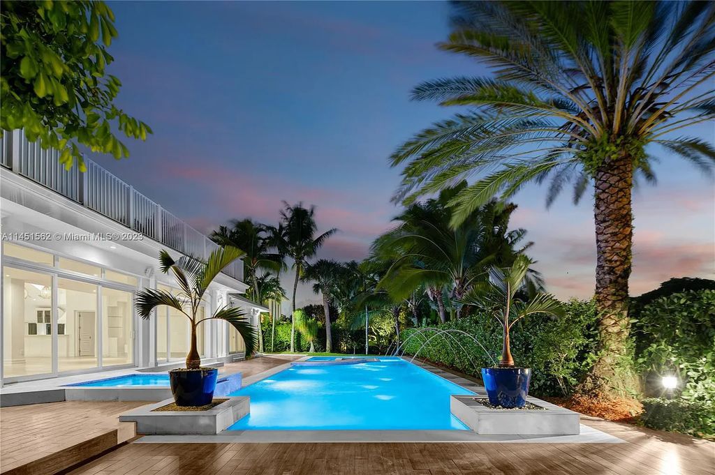 Casa Aqua is a modern-Island waterfront residence with 120 ft of water frontage, a spacious dock, and a lift to fit 2 boats. This one-story home features 7 bedrooms, 6.5 bathrooms, a gourmet kitchen, private family room, and bonus room.