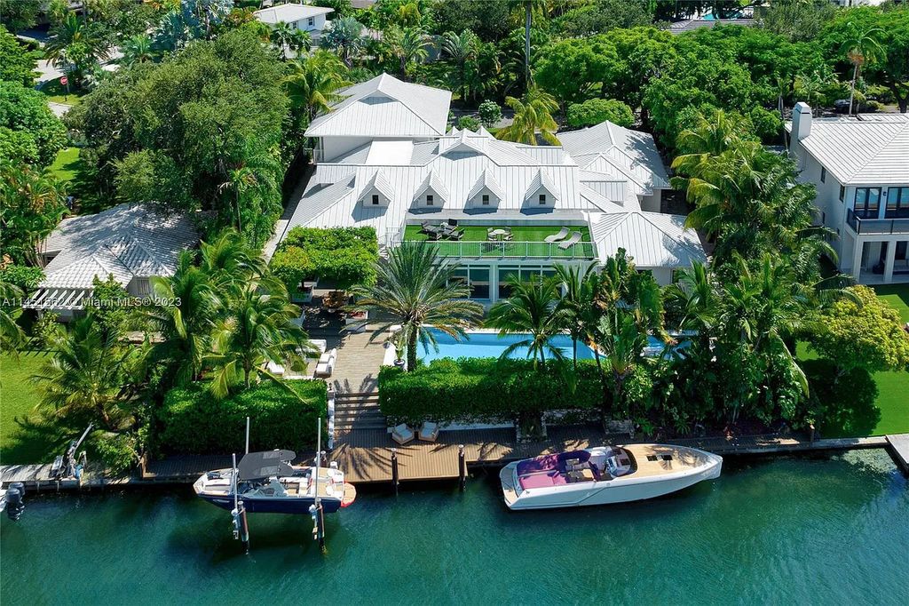 Casa Aqua is a modern-Island waterfront residence with 120 ft of water frontage, a spacious dock, and a lift to fit 2 boats. This one-story home features 7 bedrooms, 6.5 bathrooms, a gourmet kitchen, private family room, and bonus room.