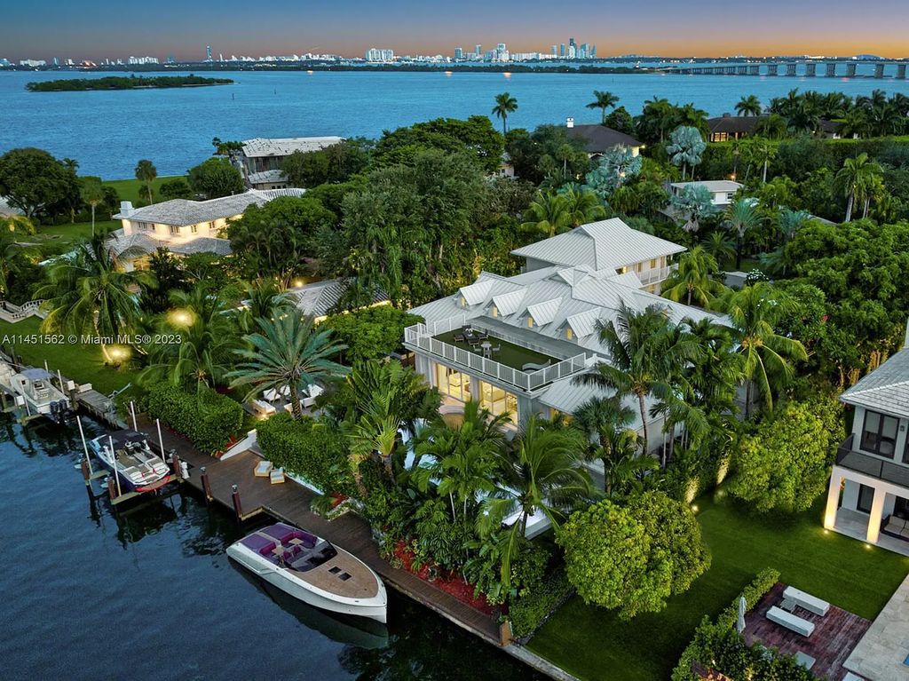 Casa Aqua is a modern-Island waterfront residence with 120 ft of water frontage, a spacious dock, and a lift to fit 2 boats. This one-story home features 7 bedrooms, 6.5 bathrooms, a gourmet kitchen, private family room, and bonus room.