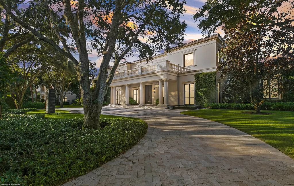 This custom Palladian-styled estate residence in Jupiter, FL offers 33,705 total square feet with 7 bedrooms, 9 baths and 3 half baths, stunning views of the Nicklaus signature golf course, and bespoke finishes throughout. The property also includes a spacious free-standing office and a separate two-story guest house.