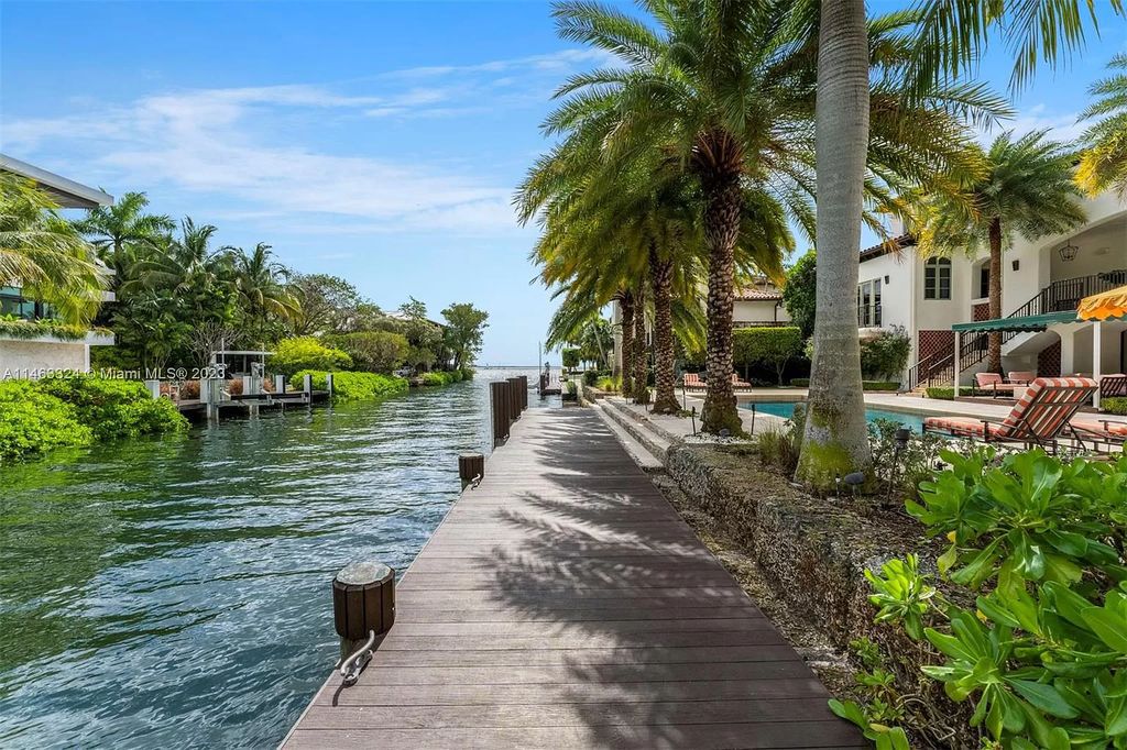 This stunning 17,873 total SF waterfront estate in The Moorings community of Coconut Grove features 7 bedrooms, 9+2 bathrooms, multiple covered terraces, a gourmet eat-in kitchen, an elegant primary suite, a pool, dock, house generator, and direct access to Biscayne Bay. Enjoy endless water views and close proximity to the finest dining, shopping, and schools.