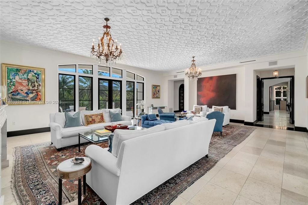 This stunning 17,873 total SF waterfront estate in The Moorings community of Coconut Grove features 7 bedrooms, 9+2 bathrooms, multiple covered terraces, a gourmet eat-in kitchen, an elegant primary suite, a pool, dock, house generator, and direct access to Biscayne Bay. Enjoy endless water views and close proximity to the finest dining, shopping, and schools.