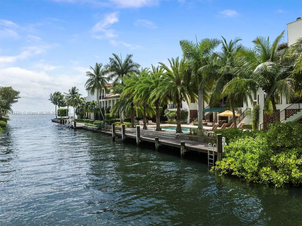 This stunning 17,873 total SF waterfront estate in The Moorings community of Coconut Grove features 7 bedrooms, 9+2 bathrooms, multiple covered terraces, a gourmet eat-in kitchen, an elegant primary suite, a pool, dock, house generator, and direct access to Biscayne Bay. Enjoy endless water views and close proximity to the finest dining, shopping, and schools.