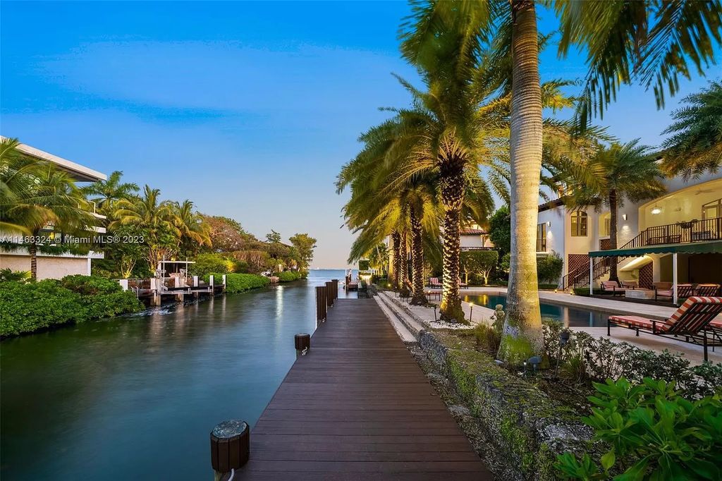 This stunning 17,873 total SF waterfront estate in The Moorings community of Coconut Grove features 7 bedrooms, 9+2 bathrooms, multiple covered terraces, a gourmet eat-in kitchen, an elegant primary suite, a pool, dock, house generator, and direct access to Biscayne Bay. Enjoy endless water views and close proximity to the finest dining, shopping, and schools.