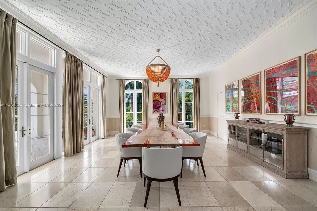 This stunning 17,873 total SF waterfront estate in The Moorings community of Coconut Grove features 7 bedrooms, 9+2 bathrooms, multiple covered terraces, a gourmet eat-in kitchen, an elegant primary suite, a pool, dock, house generator, and direct access to Biscayne Bay. Enjoy endless water views and close proximity to the finest dining, shopping, and schools.