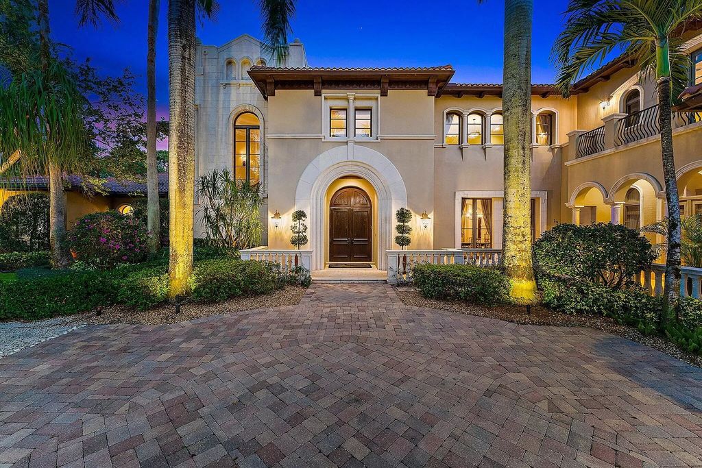 This stunning 5 bedroom, 7.5 bathroom Mediterranean villa is nestled on a private 3/4 acre lot in the prestigious Old Palm Golf Club community. With over 9,200 square feet of living space, this home boasts exceptional features such as a grand two story entry, high ceilings throughout, a spacious primary suite with dual luxury baths and sitting room, a game room, bar, wine room, chef's kitchen, and extended outdoor living space. Enjoy panoramic golf course views from the balconies or relax on the spacious paver patios with fountains. This home leaves nothing to be desired!