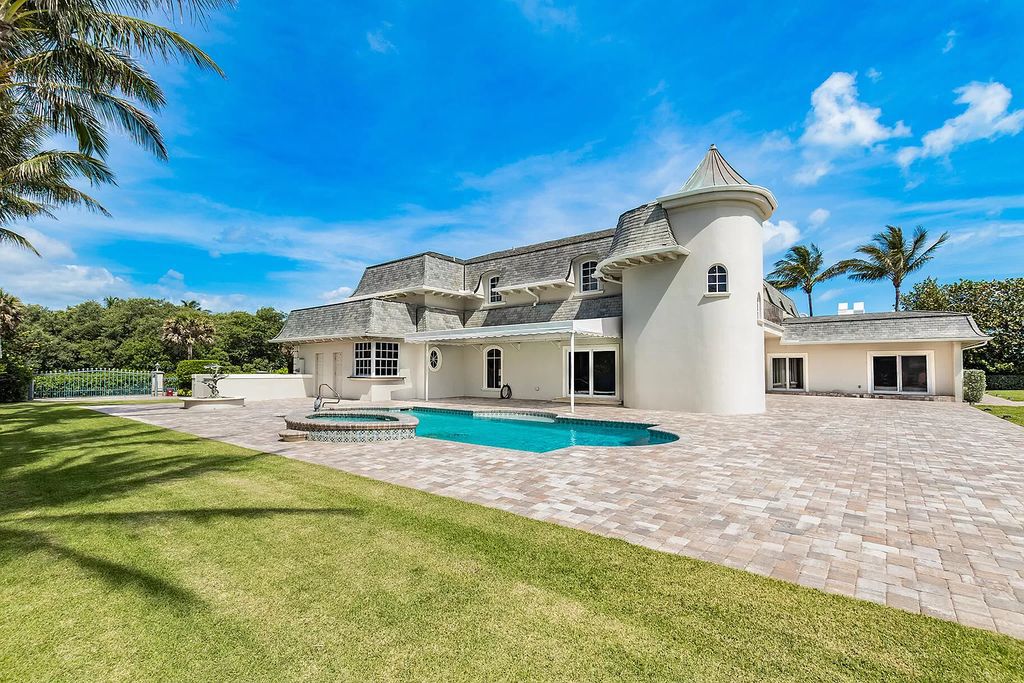 This captivating oceanfront estate on Jupiter Island offers 4 beds, 10 baths, and 2.62 acres of land with 242 feet of water frontage. Enjoy direct ocean views from every room in the house and spend your days swimming, sunbathing, and fishing.