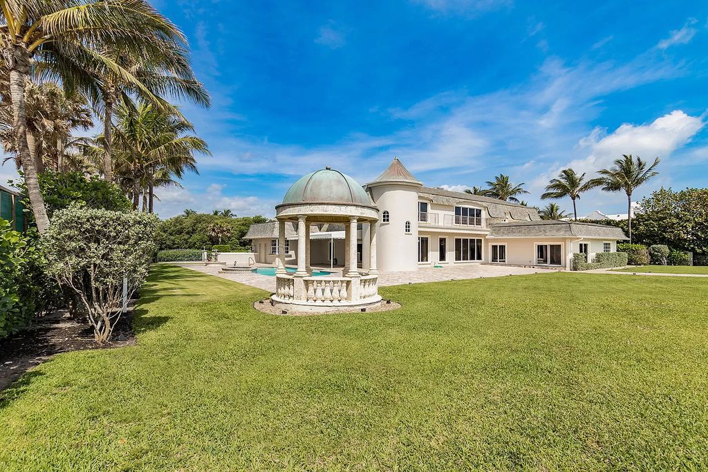 This captivating oceanfront estate on Jupiter Island offers 4 beds, 10 baths, and 2.62 acres of land with 242 feet of water frontage. Enjoy direct ocean views from every room in the house and spend your days swimming, sunbathing, and fishing.