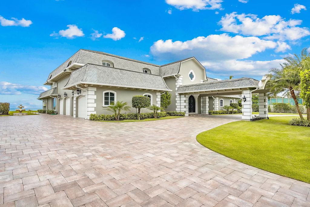 This captivating oceanfront estate on Jupiter Island offers 4 beds, 10 baths, and 2.62 acres of land with 242 feet of water frontage. Enjoy direct ocean views from every room in the house and spend your days swimming, sunbathing, and fishing.