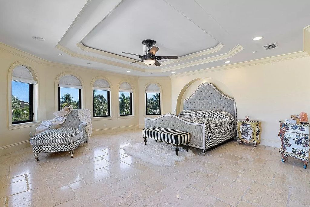 Experience the epitome of luxury living in this palatial waterfront estate in Delray Beach Shores. With 9,674 sq ft, 6-7 bedrooms, 7.2 baths, elevator, state-of-the-art theater, and more, this residence offers the perfect blend of tranquility and convenience. Immerse yourself in the dream of luxury waterfront living with breathtaking custom finishings, awe-inspiring views, and a heated infinity pool.