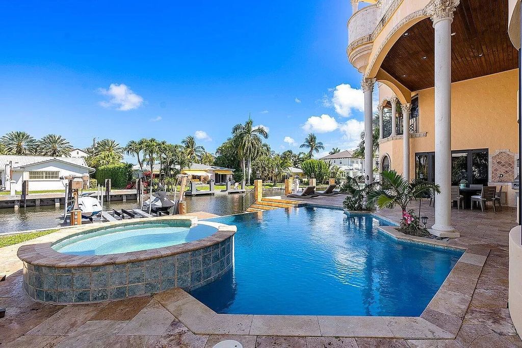 Experience the epitome of luxury living in this palatial waterfront estate in Delray Beach Shores. With 9,674 sq ft, 6-7 bedrooms, 7.2 baths, elevator, state-of-the-art theater, and more, this residence offers the perfect blend of tranquility and convenience. Immerse yourself in the dream of luxury waterfront living with breathtaking custom finishings, awe-inspiring views, and a heated infinity pool.