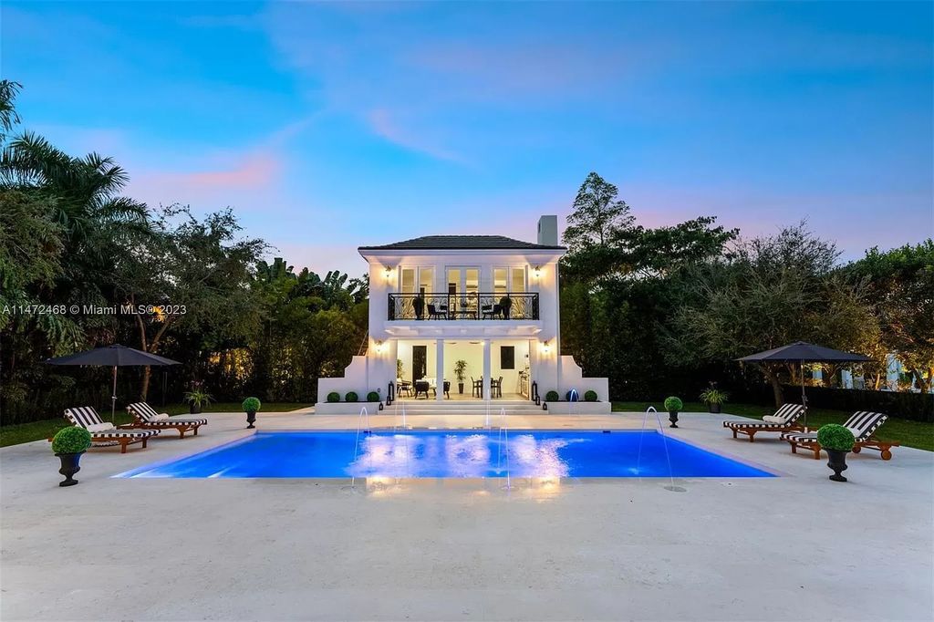 This 8-bedroom, 7.5-bathroom estate on a sprawling 30,862 SF lot features volume ceilings, marble and herringbone hardwood floors, impact windows/doors, a chef's kitchen, al fresco dining/living area, summer kitchen, pool with underwater audio system, cabana bath, security system, whole-house generator, and insulated 3-car garage with AC. Final phase of construction completed in 11/2023.