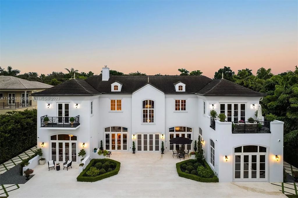 This 8-bedroom, 7.5-bathroom estate on a sprawling 30,862 SF lot features volume ceilings, marble and herringbone hardwood floors, impact windows/doors, a chef's kitchen, al fresco dining/living area, summer kitchen, pool with underwater audio system, cabana bath, security system, whole-house generator, and insulated 3-car garage with AC. Final phase of construction completed in 11/2023.