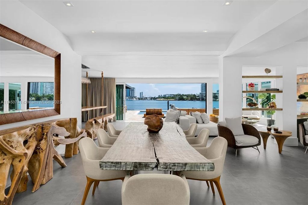 This magnificent waterfront property in Miami Beach, FL offers 90 feet of pristine water frontage, breathtaking views, and direct access to the beautiful waterways of Miami. The home features an open floor plan, a new summer kitchen with a Brazilian-style BBQ and pizza oven, gas fireplaces poolside and dockside, a custom 4-car garage, and more.