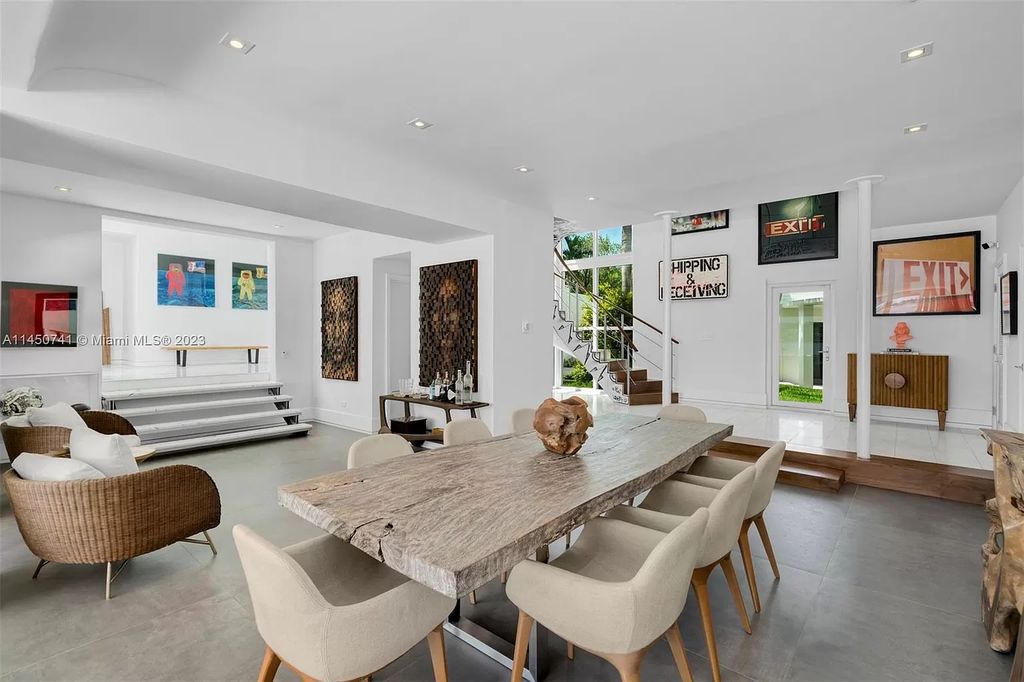 This magnificent waterfront property in Miami Beach, FL offers 90 feet of pristine water frontage, breathtaking views, and direct access to the beautiful waterways of Miami. The home features an open floor plan, a new summer kitchen with a Brazilian-style BBQ and pizza oven, gas fireplaces poolside and dockside, a custom 4-car garage, and more.