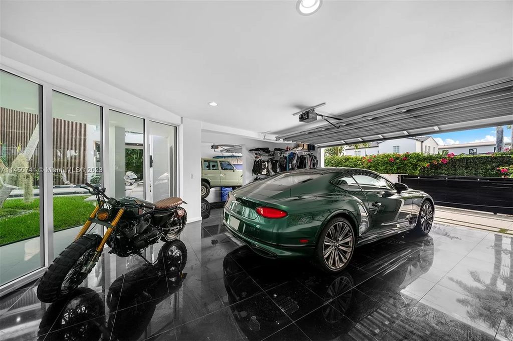 This magnificent waterfront property in Miami Beach, FL offers 90 feet of pristine water frontage, breathtaking views, and direct access to the beautiful waterways of Miami. The home features an open floor plan, a new summer kitchen with a Brazilian-style BBQ and pizza oven, gas fireplaces poolside and dockside, a custom 4-car garage, and more.