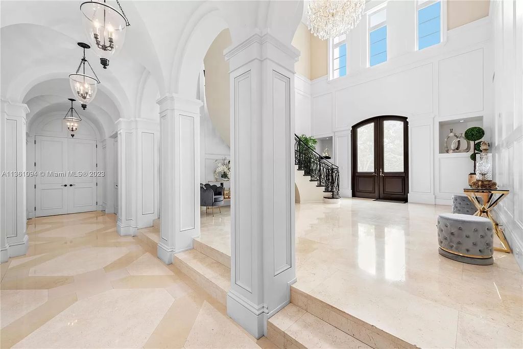 This stunning palatial Neoclassical estate in Coral Gables is the perfect entertainer's dream, with an enormous entertainment wing, movie theater, private guest suite, and resort-style amenities. The 4000sf master wing features a gym, dual closets, luxurious bathroom, large sitting room/office, and expansive terraces. Also includes separate staff/in-law quarters, oversized garages for 6 cars, and access to a 40ft boat slip in Snapper Creek Marina.