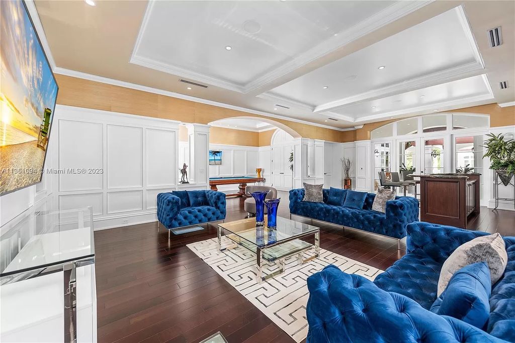 This stunning palatial Neoclassical estate in Coral Gables is the perfect entertainer's dream, with an enormous entertainment wing, movie theater, private guest suite, and resort-style amenities. The 4000sf master wing features a gym, dual closets, luxurious bathroom, large sitting room/office, and expansive terraces. Also includes separate staff/in-law quarters, oversized garages for 6 cars, and access to a 40ft boat slip in Snapper Creek Marina.